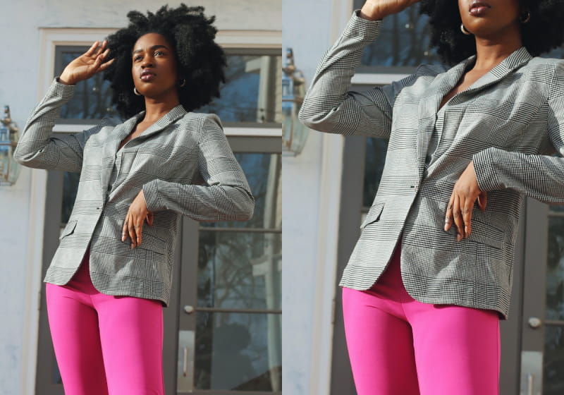 mulher negra estilosa posando para a foto com blazer e calça rosa